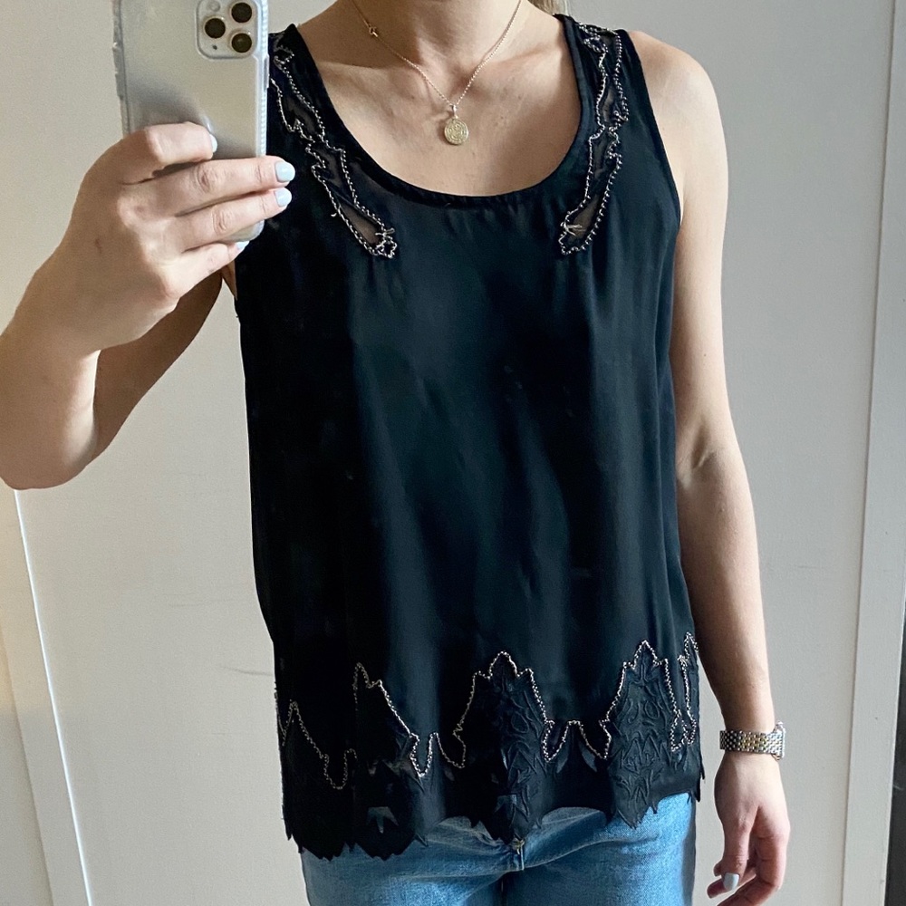 Black sleeveless blouse